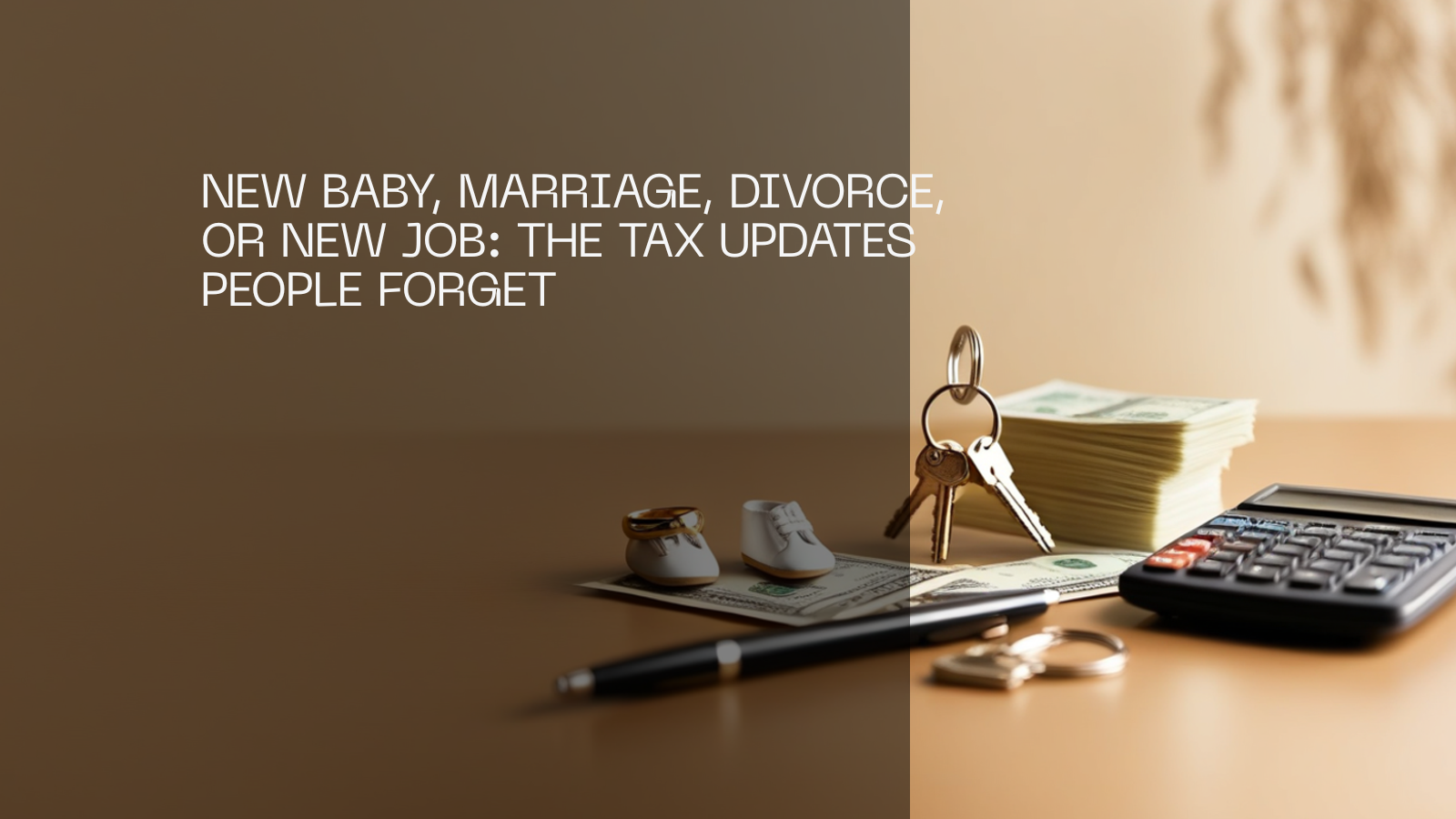 Wedding rings, tiny baby shoes, house keys, a pen, US cash and a calculator on a desk.